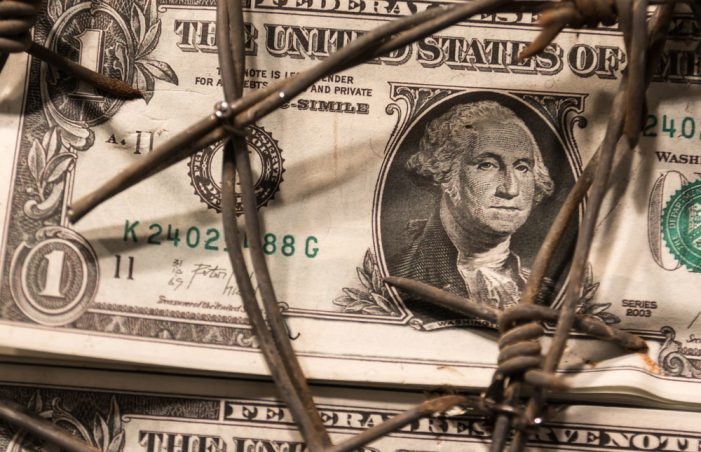 image of money and barbed wire
